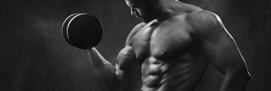 Man Holding Black Dumbbell